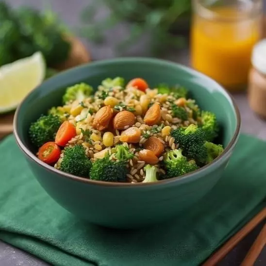 bowl with healthy food (broccoli, nuts, tomatoes)